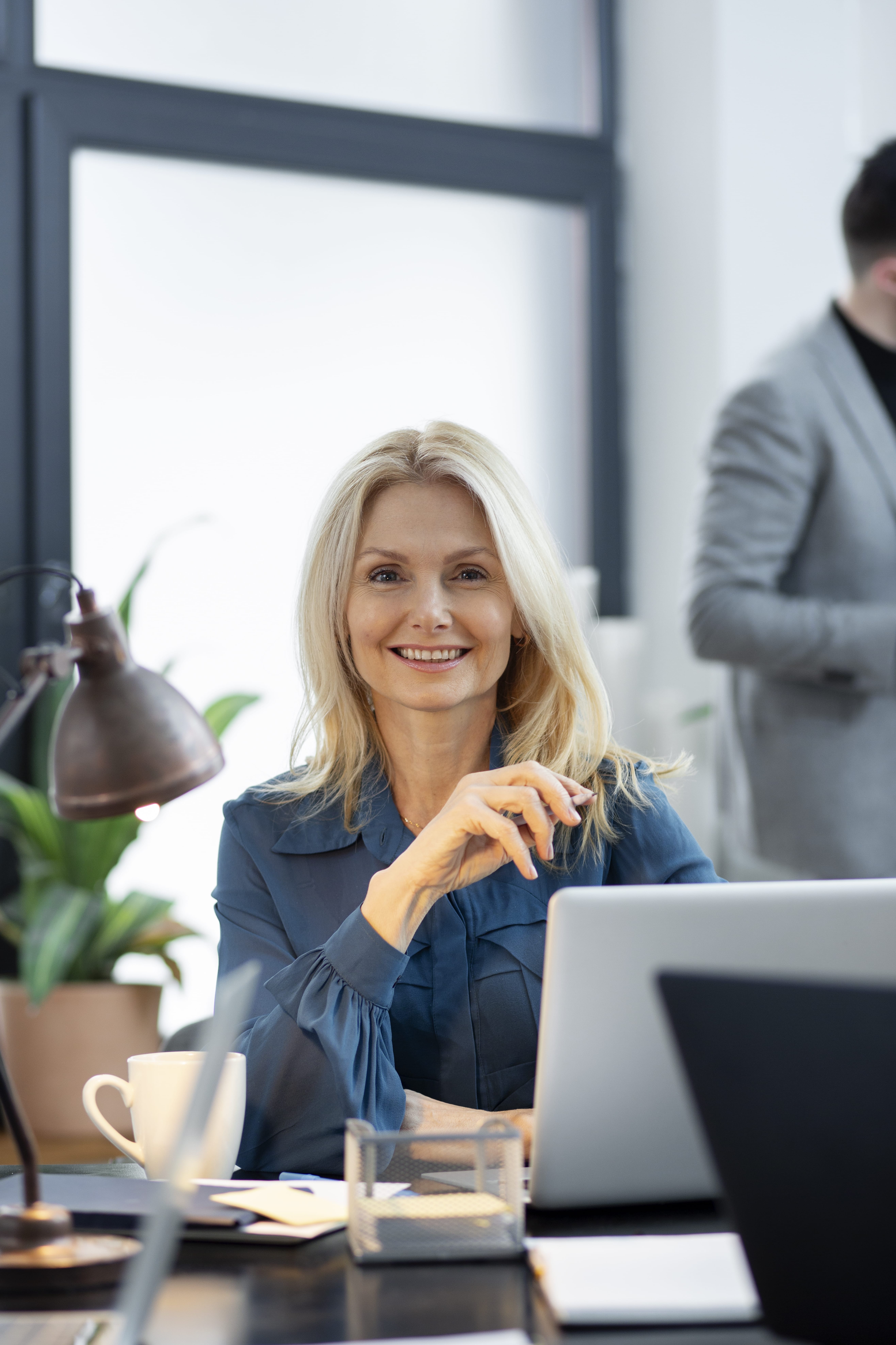 close-up-smiley-woman-desk (1)